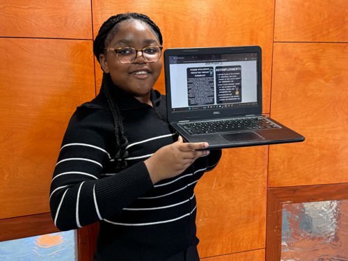 Girls Code Savannah student Righteous showcasing her winning science fair project about AI